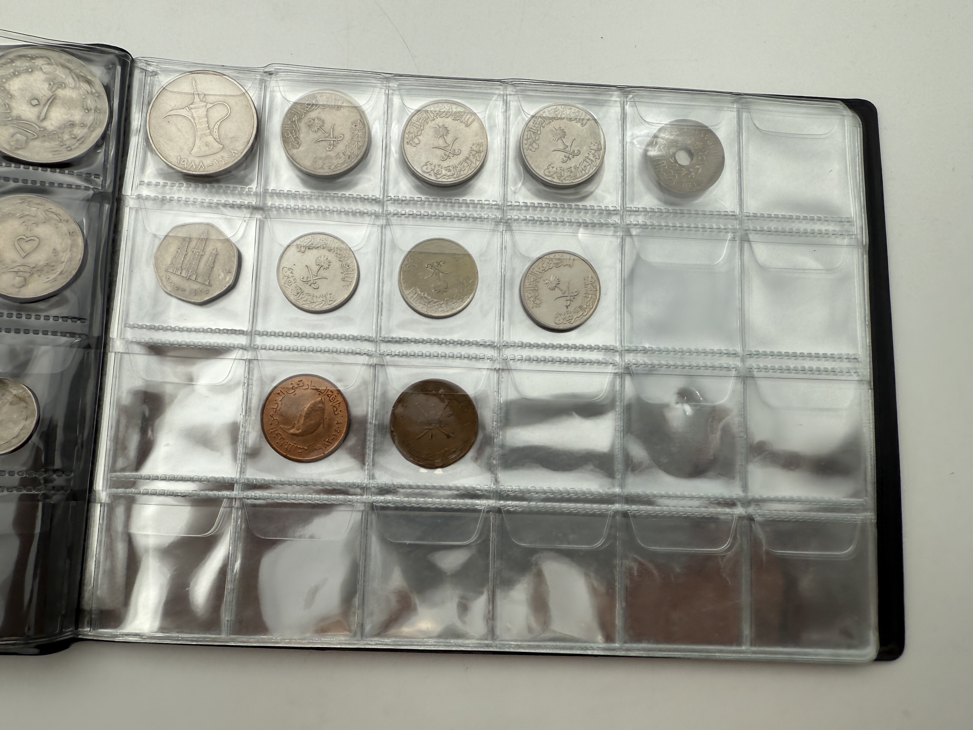 Iran / Lebanon / Malaysia / United Arab Emirates - a collection of several dozents coins arranged in a special coin ... - 1 5