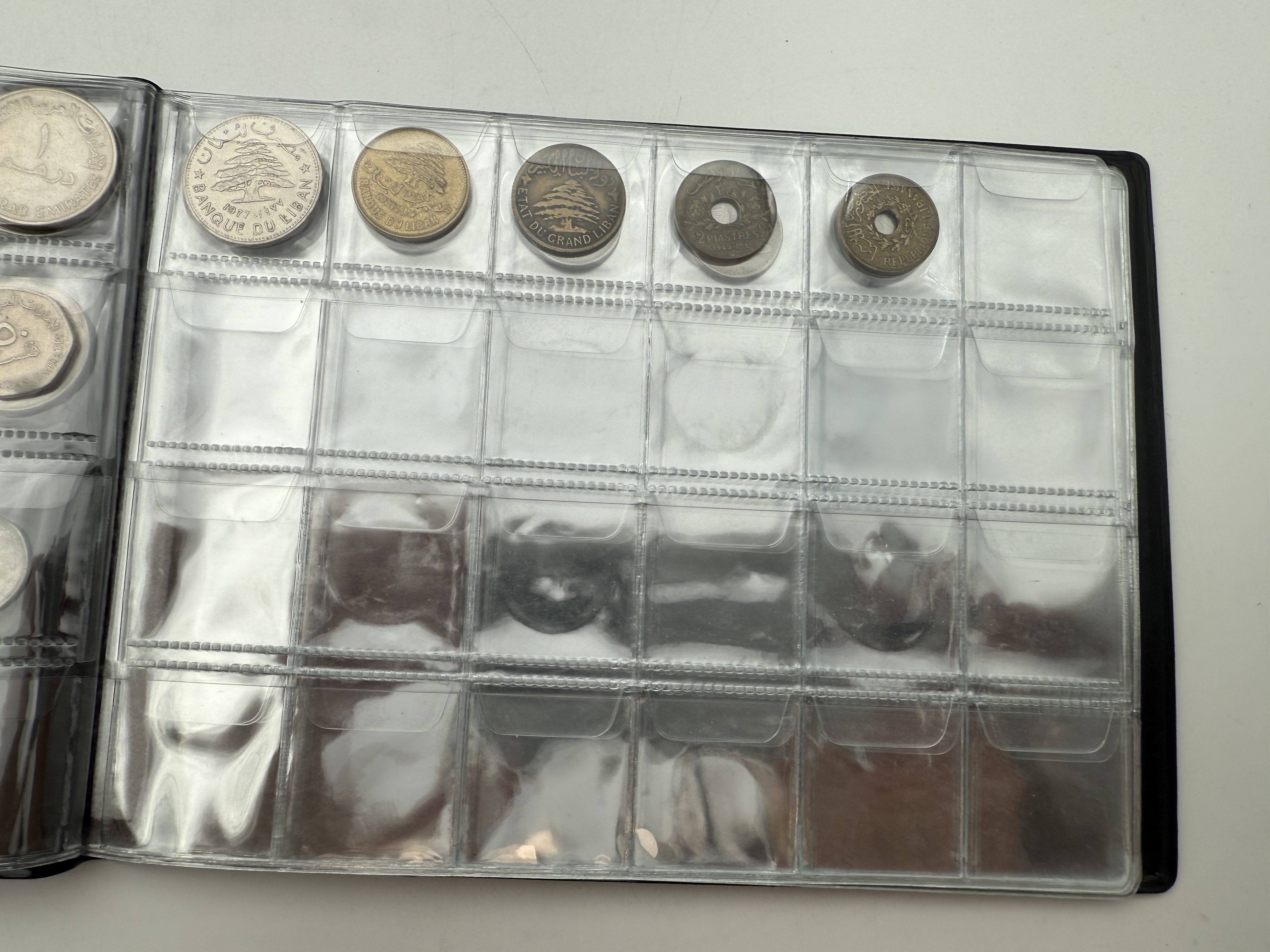 Iran / Lebanon / Malaysia / United Arab Emirates - a collection of several dozents coins arranged in a special coin ... - 1 7