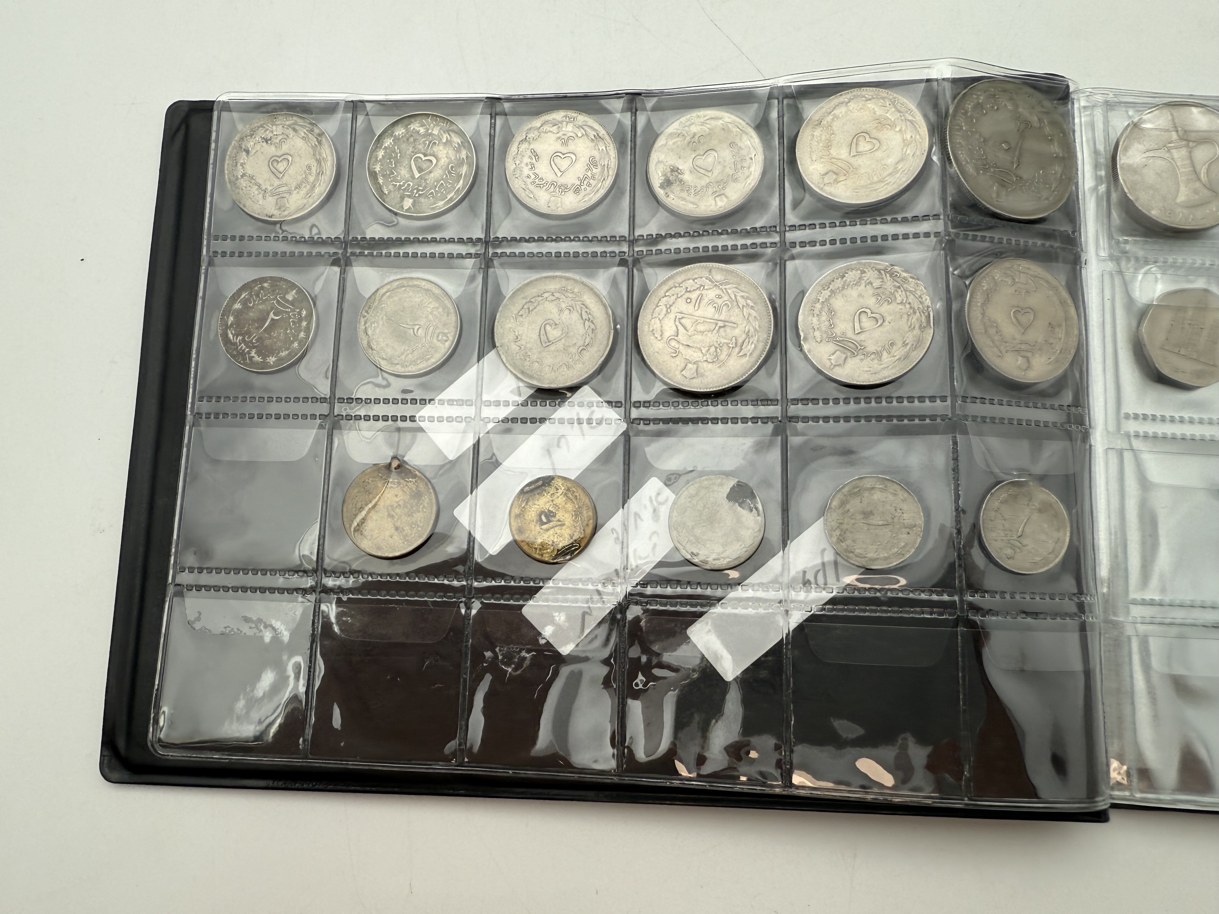 Iran / Lebanon / Malaysia / United Arab Emirates - a collection of several dozents coins arranged in a special coin ... - 1 4