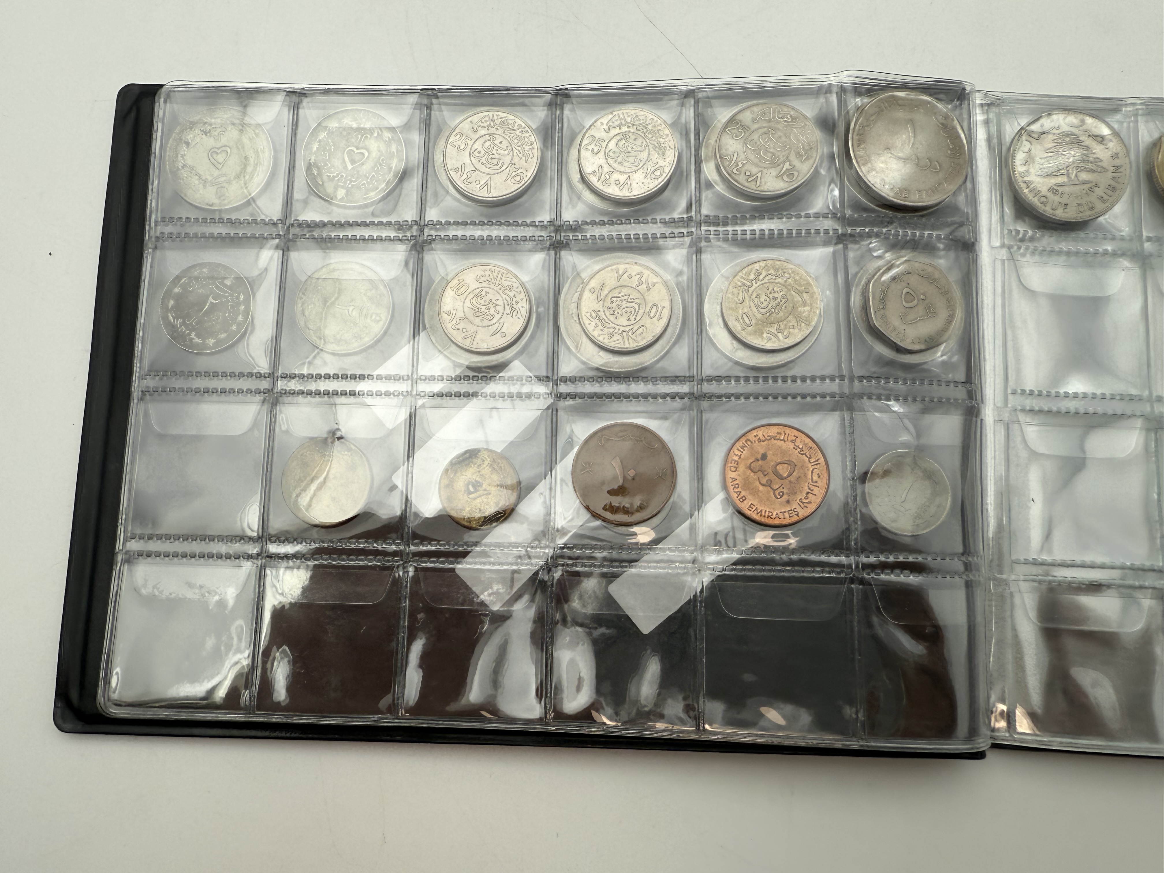 Iran / Lebanon / Malaysia / United Arab Emirates - a collection of several dozents coins arranged in a special coin ... - 1 6