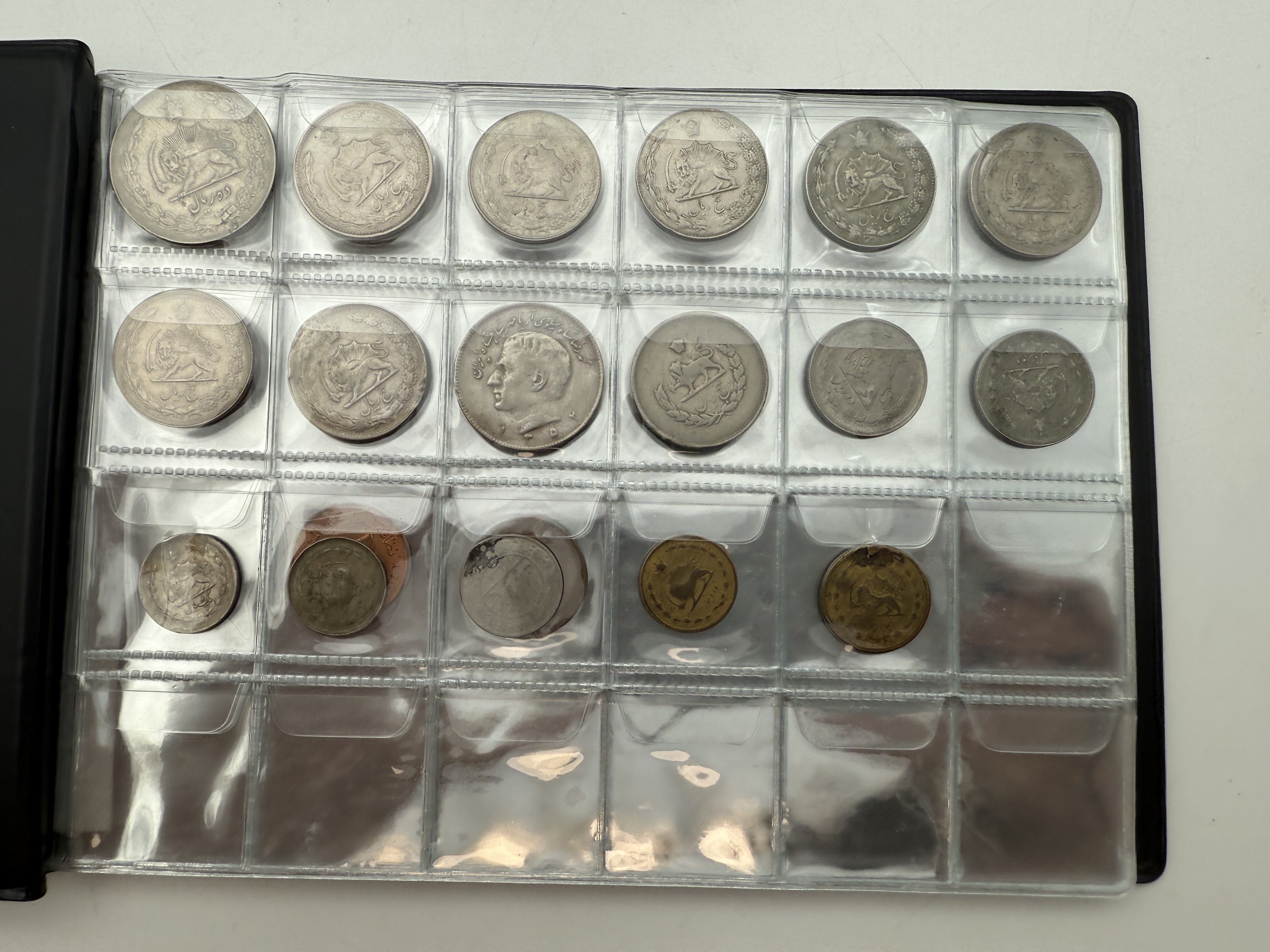 Iran / Lebanon / Malaysia / United Arab Emirates - a collection of several dozents coins arranged in a special coin ... - 1 2