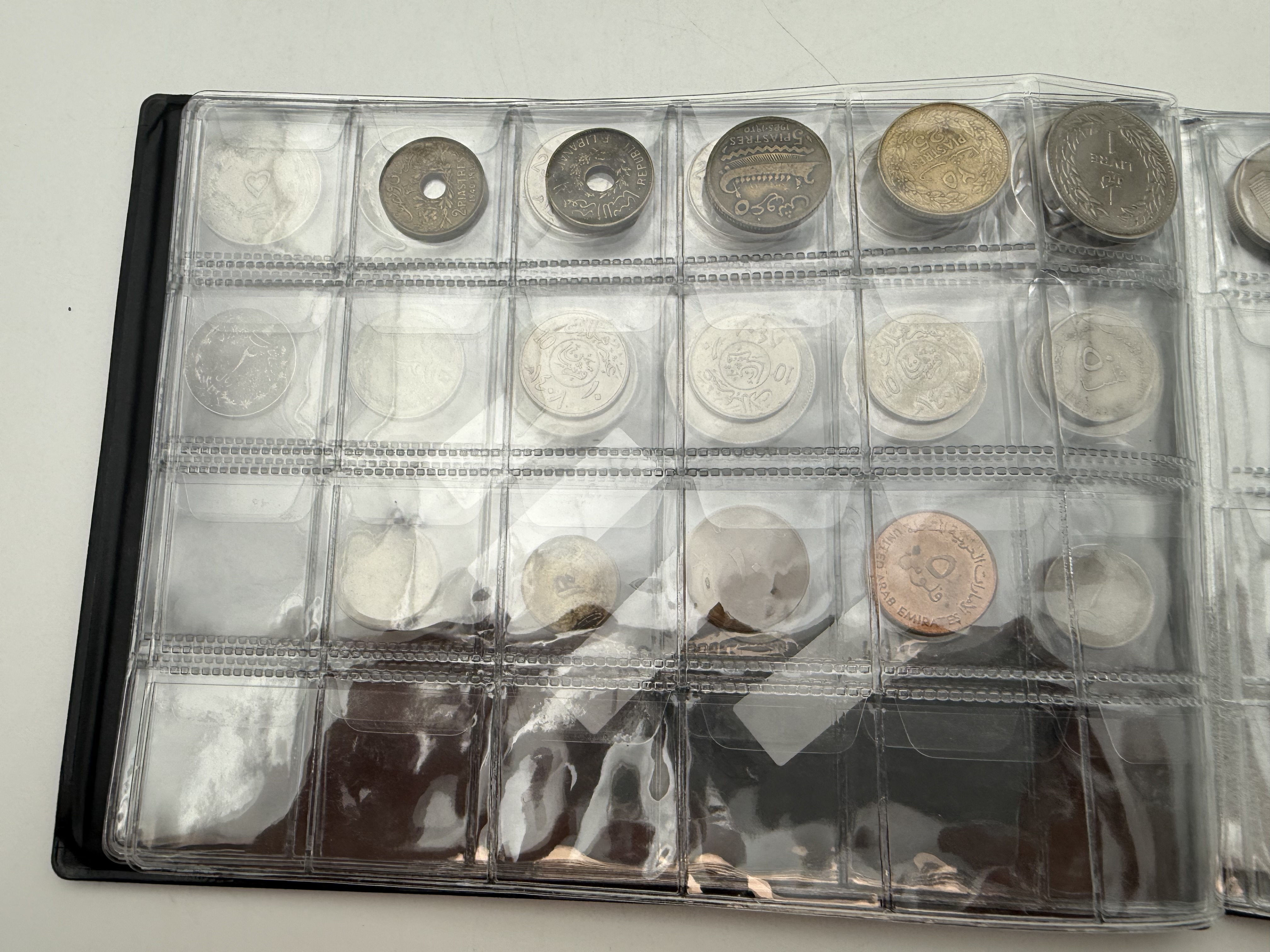 Iran / Lebanon / Malaysia / United Arab Emirates - a collection of several dozents coins arranged in a special coin ... - 1 8