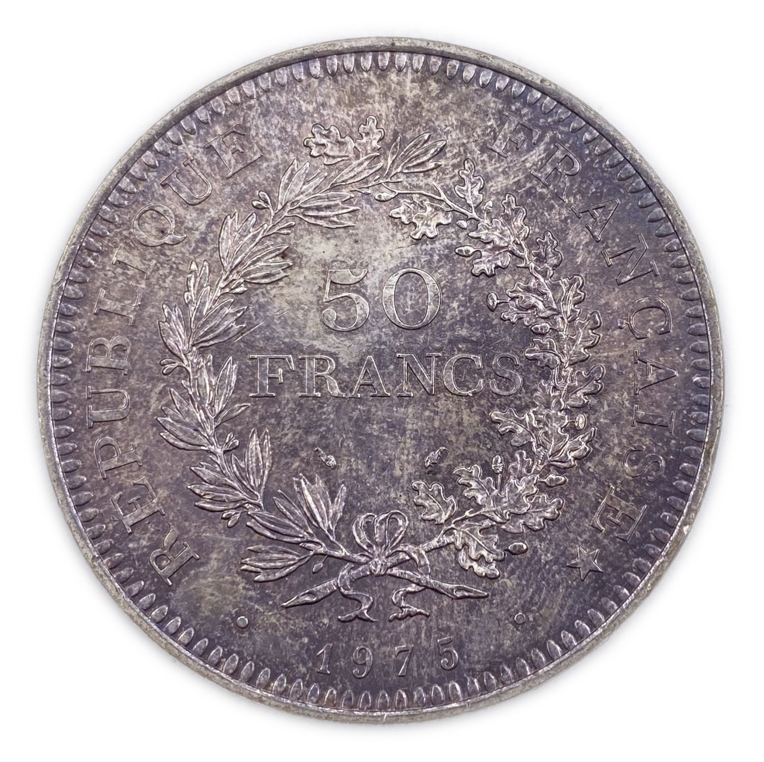 France - 50 Francs 1975 - Silver 900, 30g, 41mm
Obverse: The denomination within a wreath and the ...