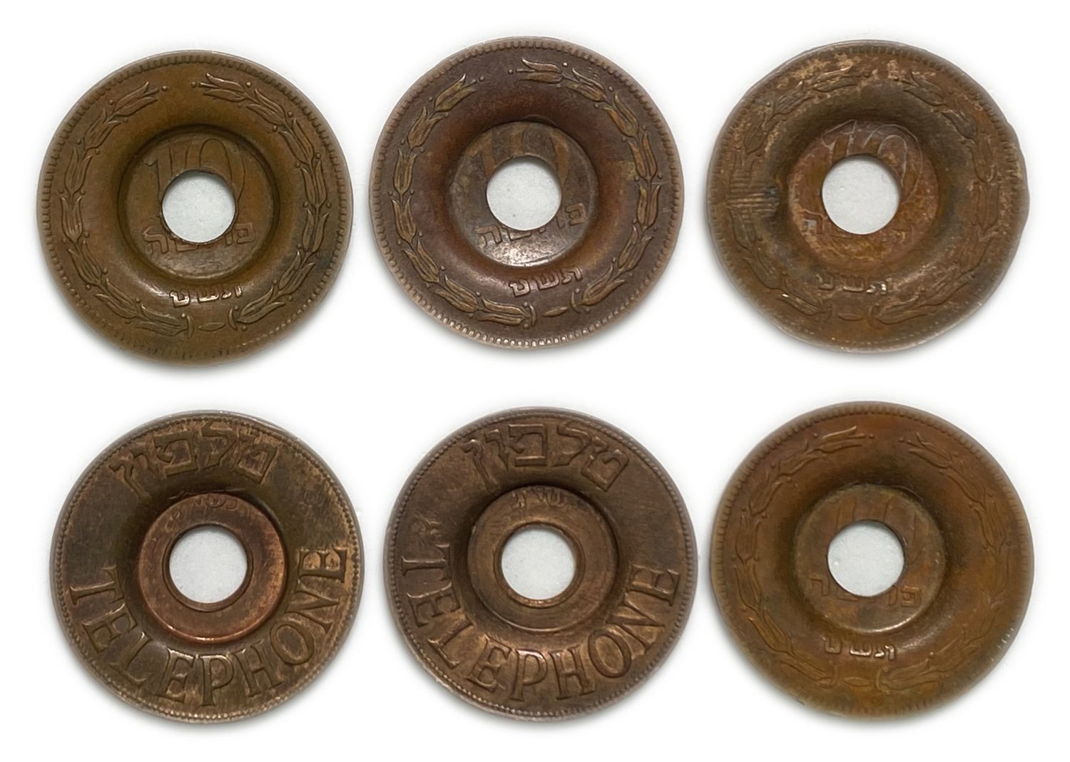 Israel - a pair of telephone tokens, one original and the other fake, 1950s
It can be noticed ...