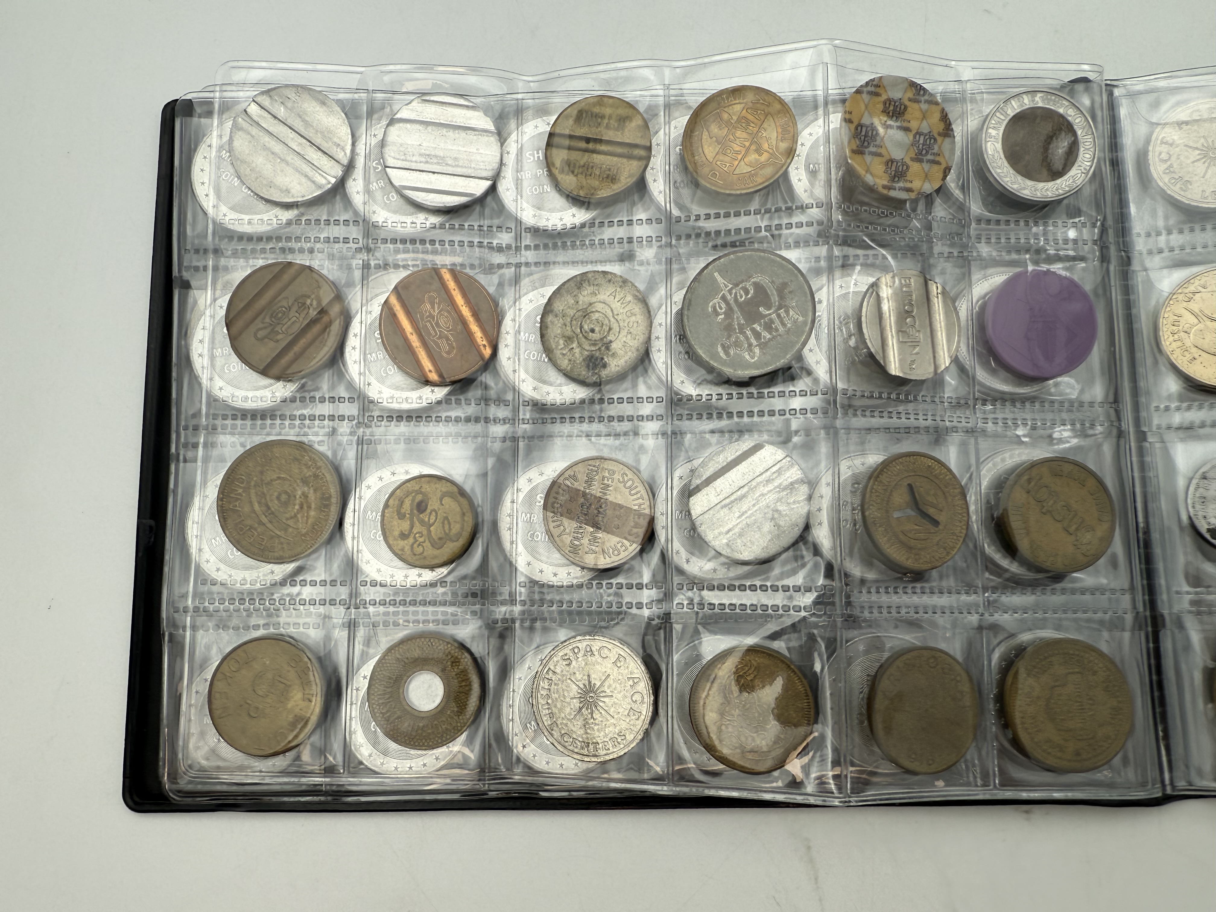 World - A collection of several hundred tokens and medals from several different countries, arranged in a special ... - 1 16