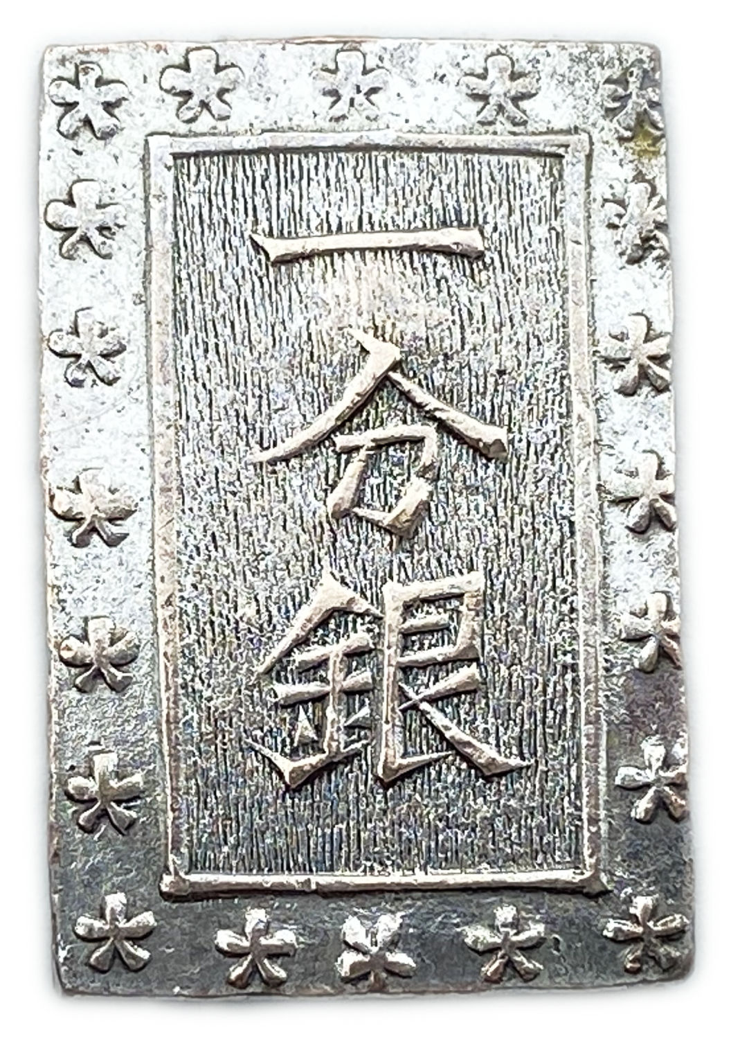 Japan - 1 Bu 1868 - Silver 991, 6.73g
Obverse
Incuse stamp 定 (= Jo) over 4 kanji in ... - 1 0