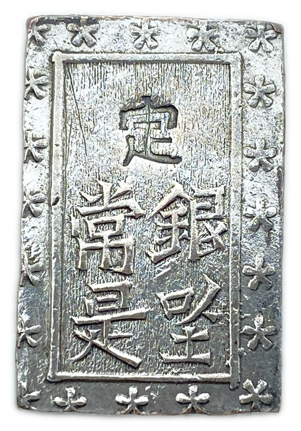 Japan - 1 Bu 1868 - Silver 991, 6.73g
Obverse
Incuse stamp 定 (= Jo) over 4 kanji in ... - 1 1