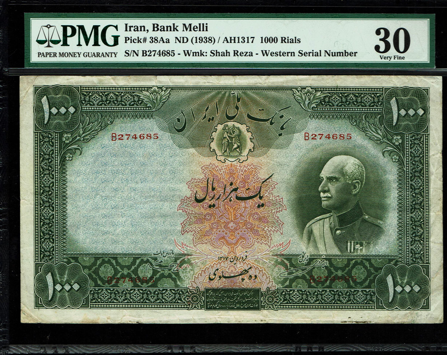 Iran - 1,000 Rials 1938 (AH1317) - Western serial number - PMG 30
Face: Portrait Shah Reza in ... - 1 0