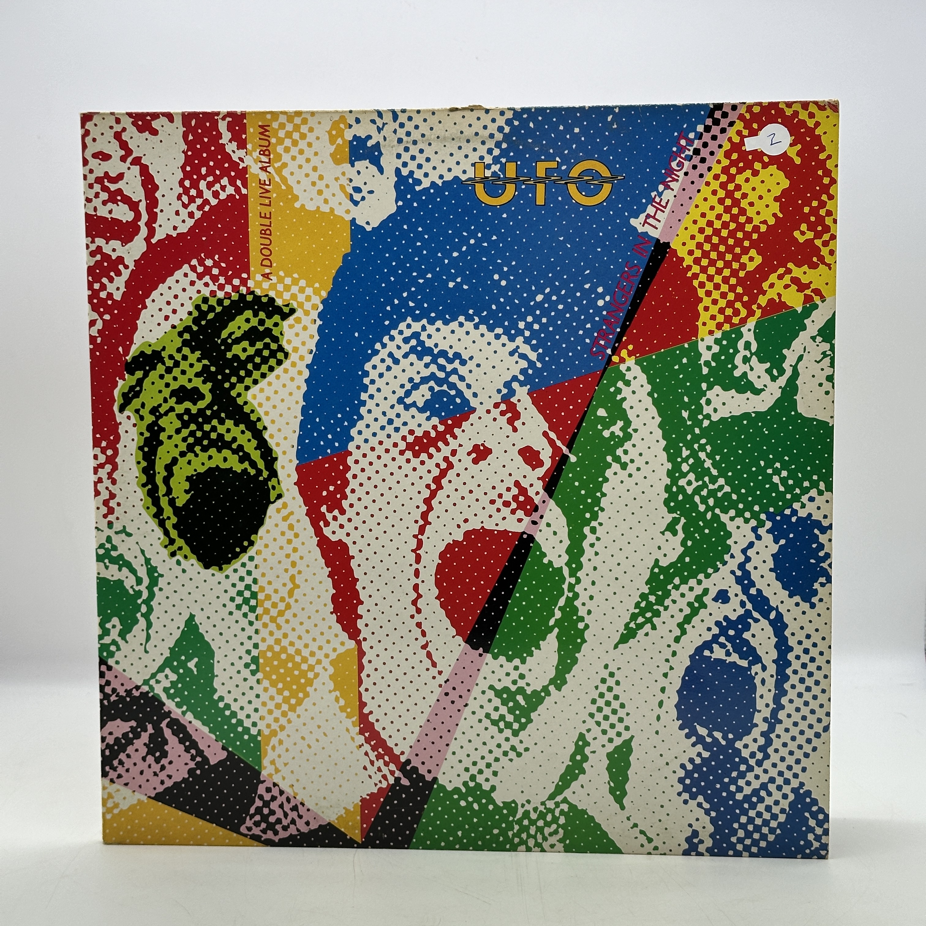 A double 12 inch vinyl by UFO album - Strangers in the Night Live,cover in good condition, vinyls are in good ... - 1 0