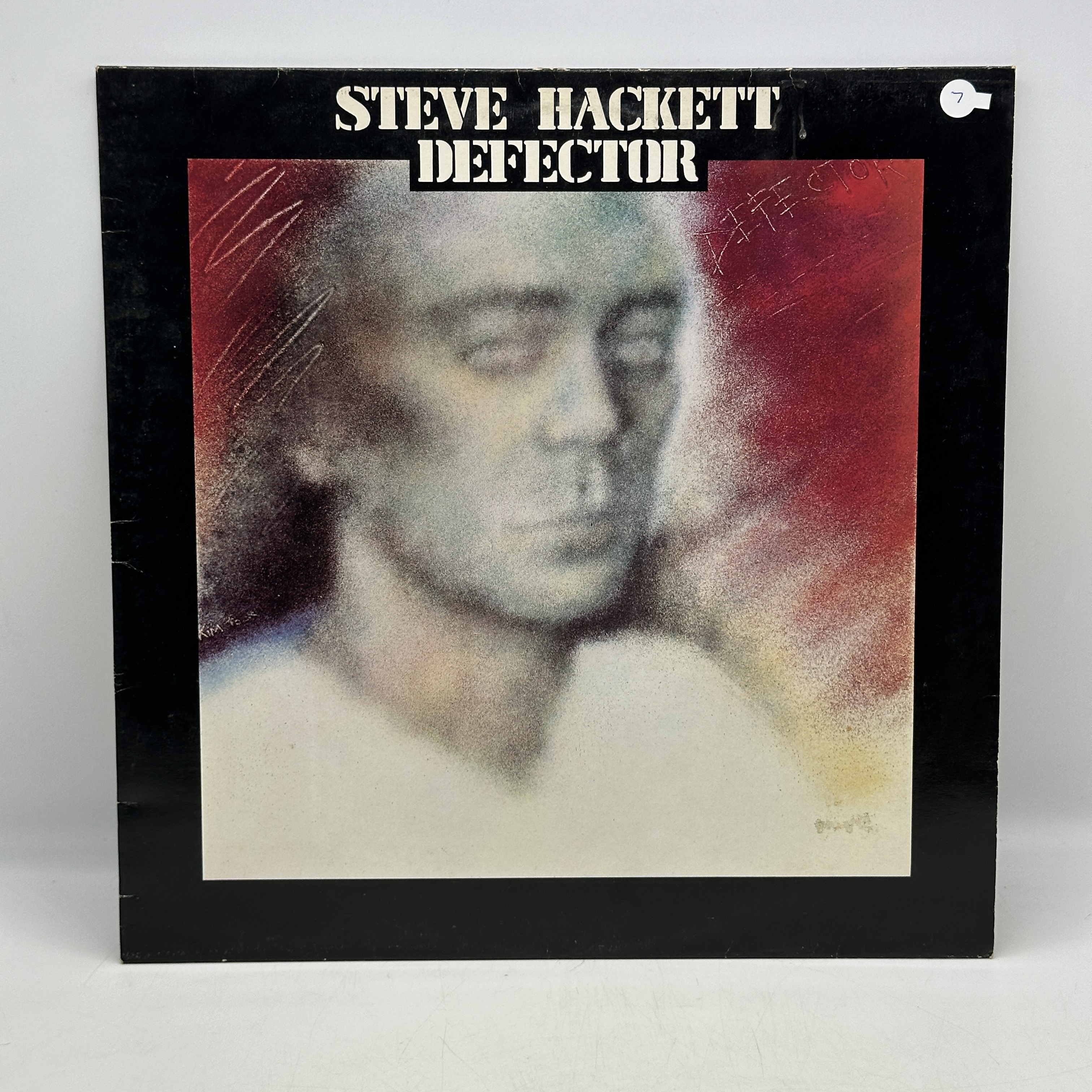 A 12 inch vinyl album by Steve Hackett - Defector, cover is in good order, vinyl has no scratches - 1 0