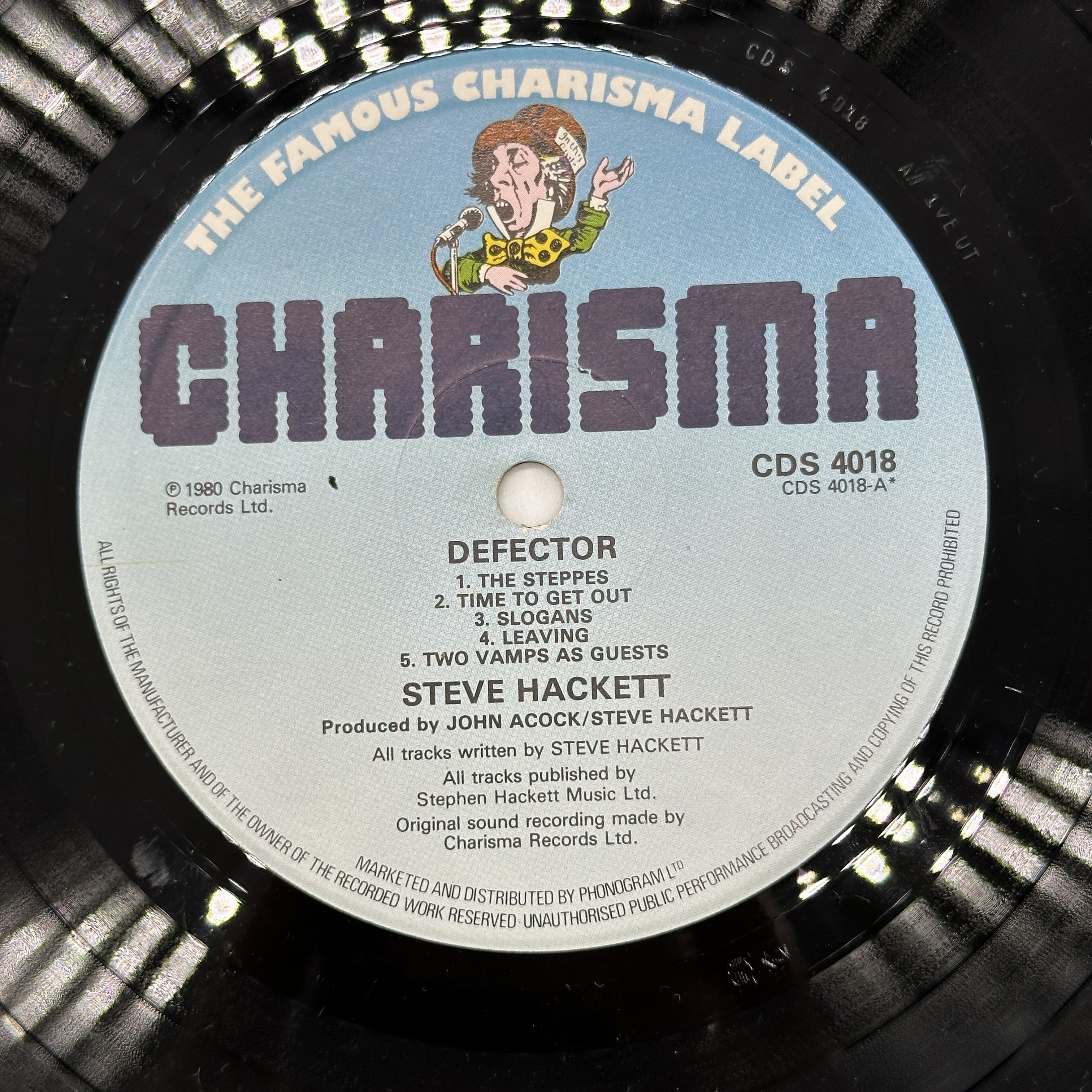 A 12 inch vinyl album by Steve Hackett - Defector, cover is in good order, vinyl has no scratches - 1 3