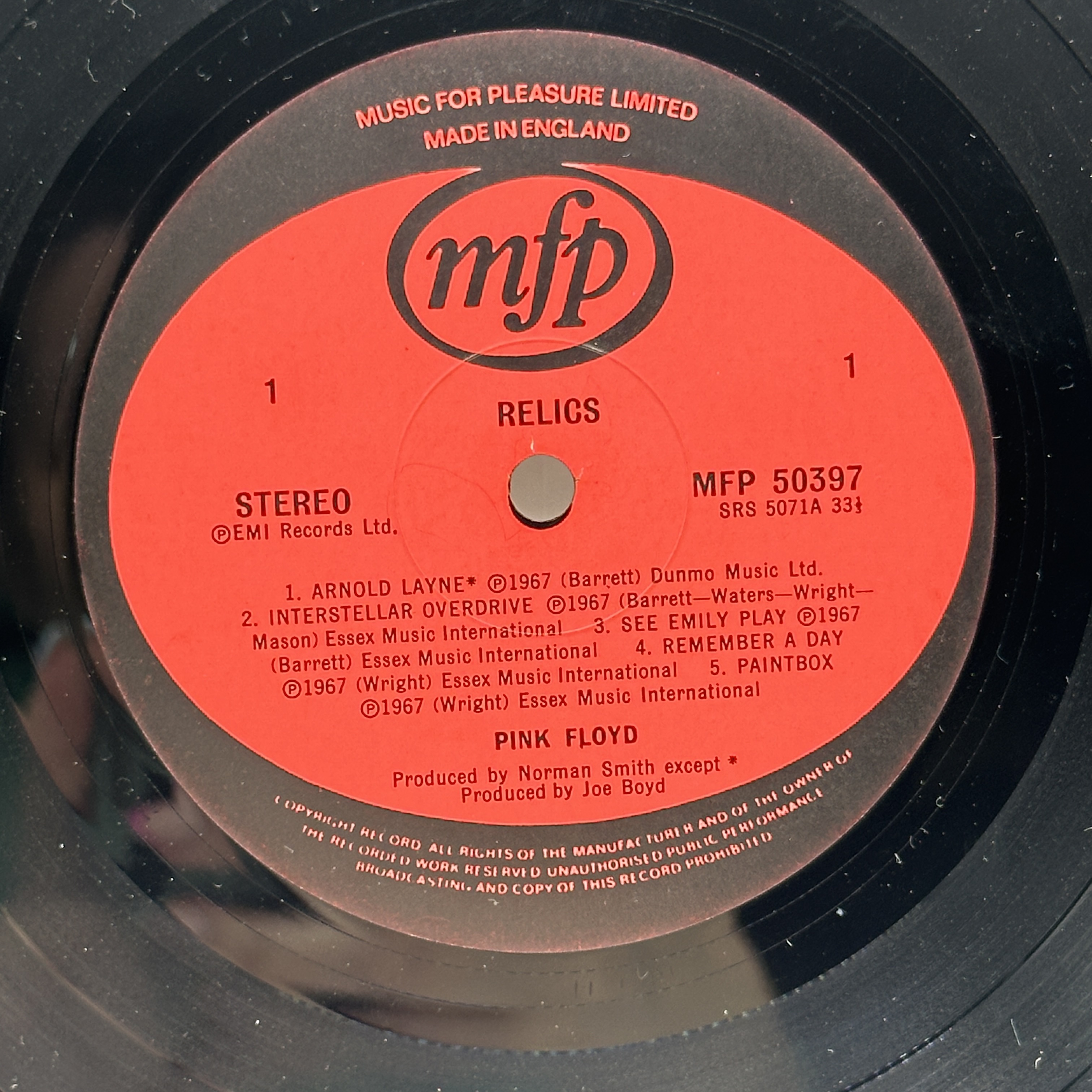 A 12 inch vinyl album by Pink Floyd - Relics, cover has a few age marks on it, vinyl is in good condition, no scratches - 1 2