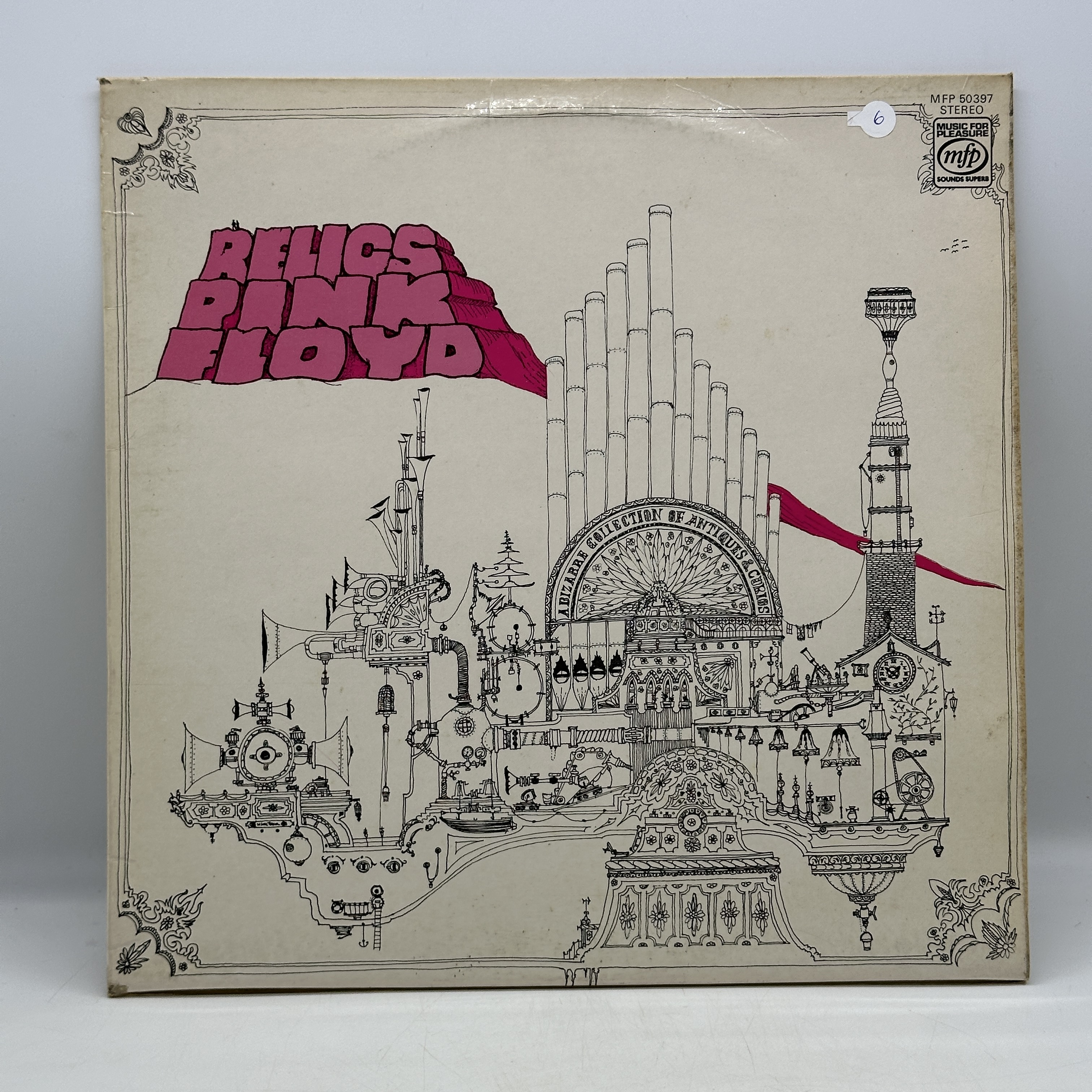 A 12 inch vinyl album by Pink Floyd - Relics, cover has a few age marks on it, vinyl is in good condition, no scratches - 1 0
