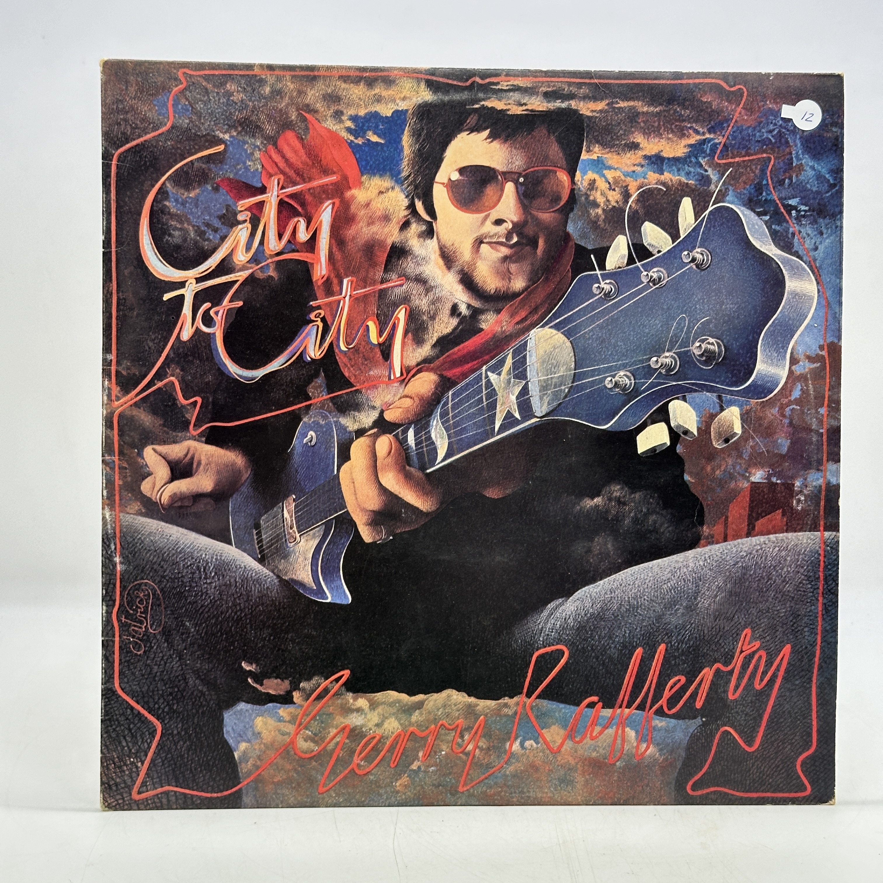 A 12 inch vinyl album by Gerry Rafferty - City to City, cover is in good condition, vinyl is in good order no scratches - 1 0