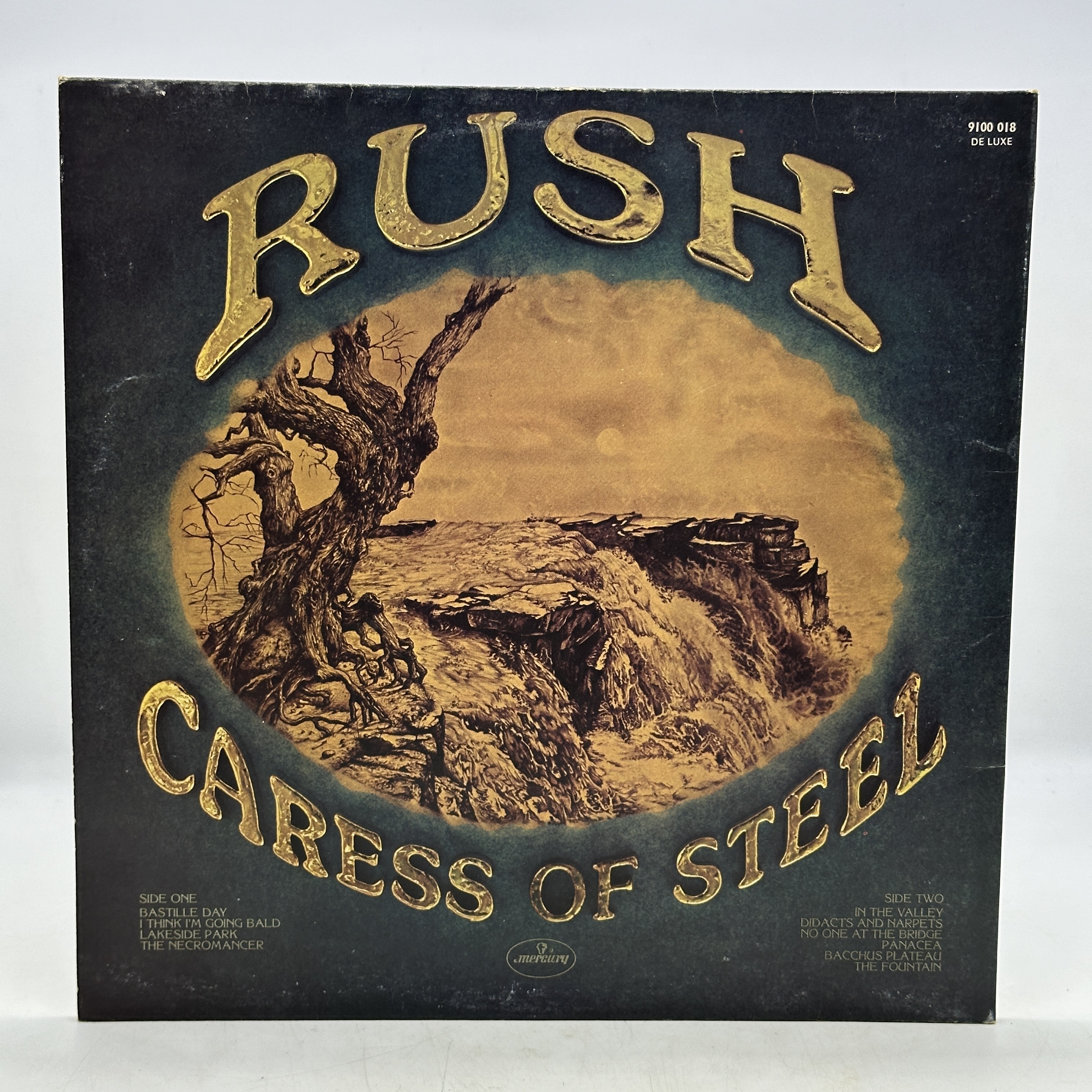 A 12 inch vinyl album by Rush - Caress of Steel, cover is in good order, no scratches - 1 2