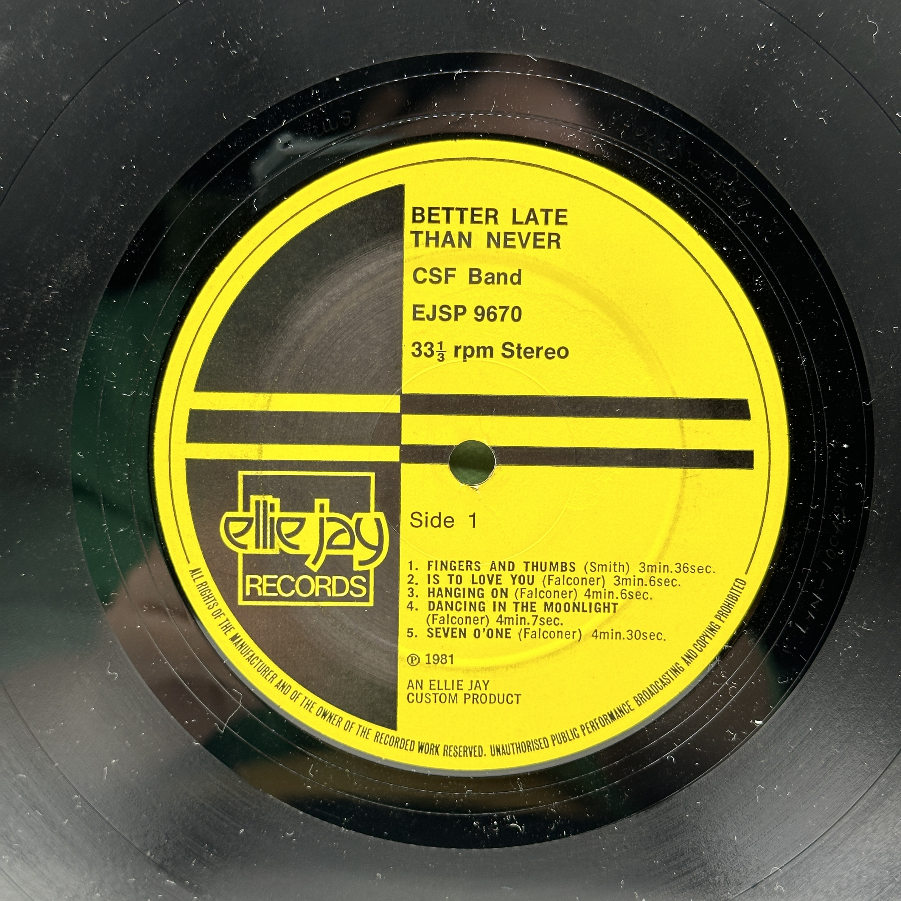 A 12 inch vinyl album by CSF Band - Better Late Than Never, cover has aging at the corners, no scratches - 1 2