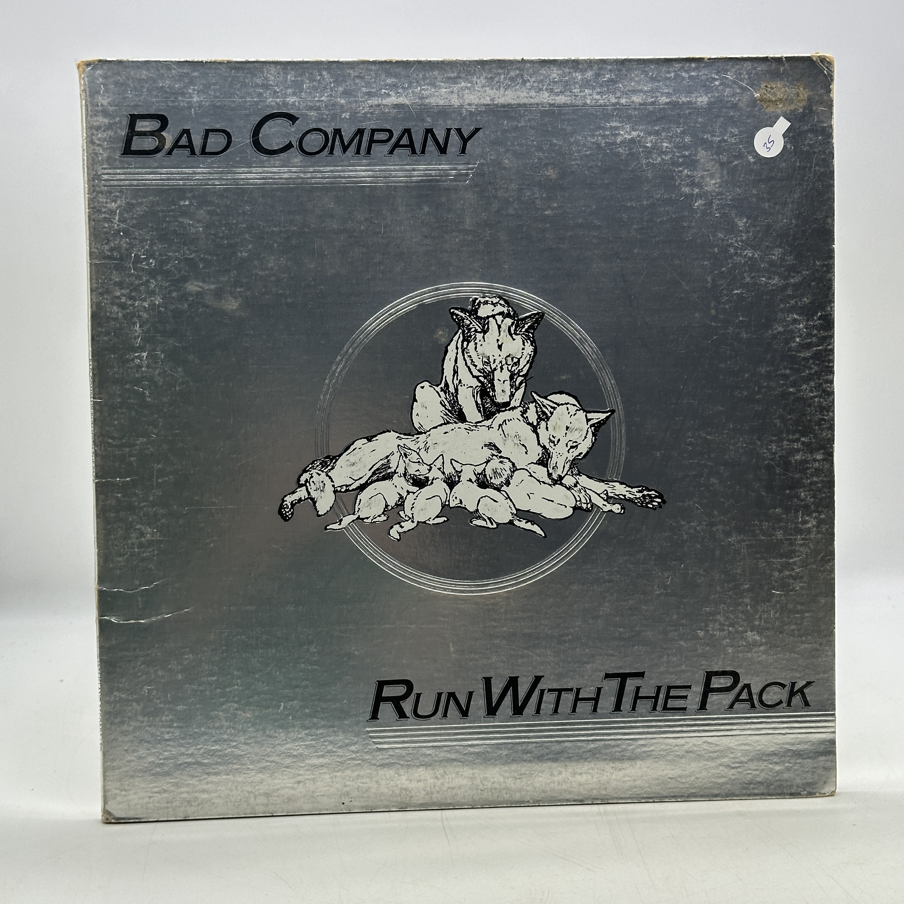A 12 inch vinyl album by Bad Company - Run With the Pack, cover has some age scuffs on the edges, no scratches on ... - 1 0