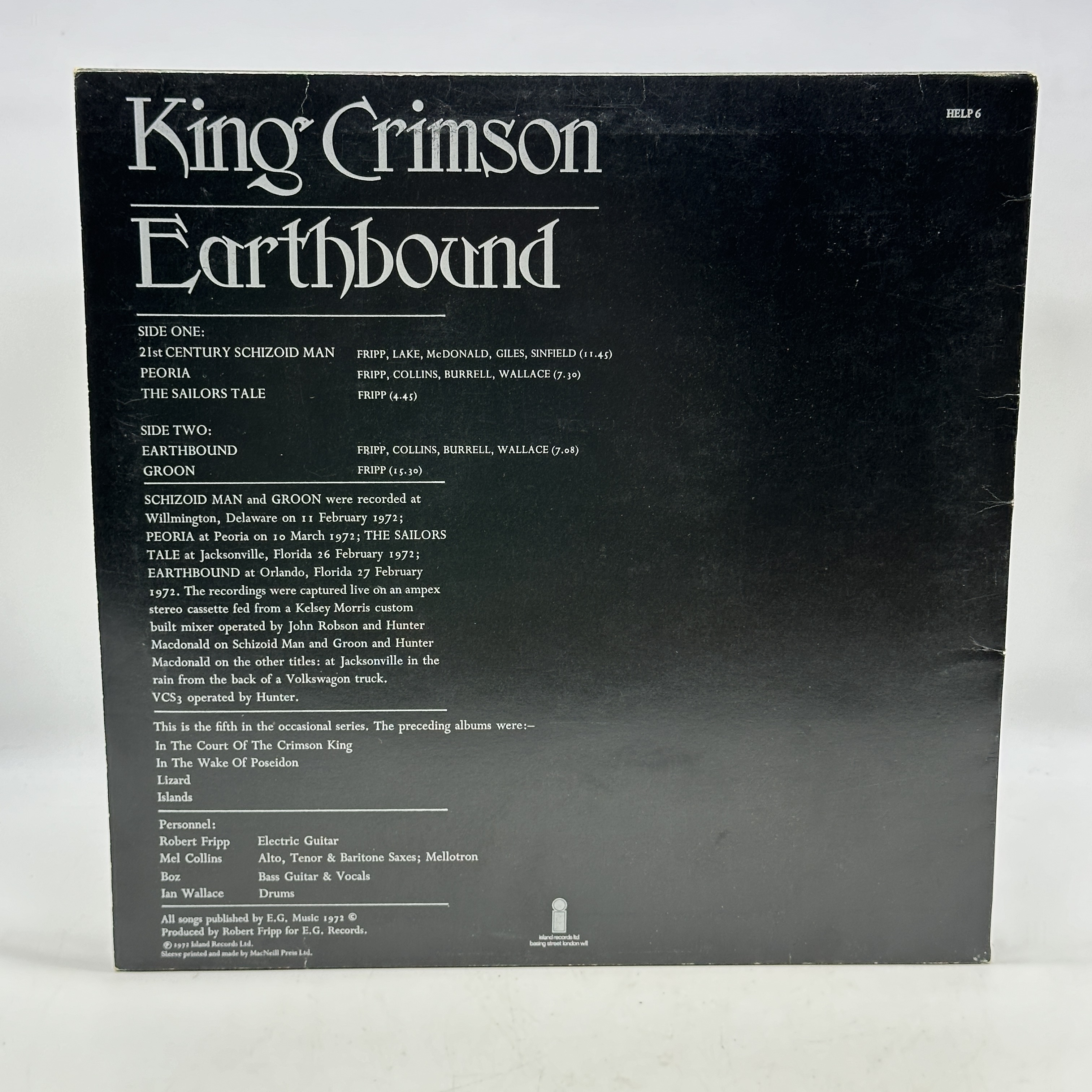 A 12 inch vinyl album by King Crimson - Earthbound, cover is in good condition, inner cover has a rip, no scratches - 1 1