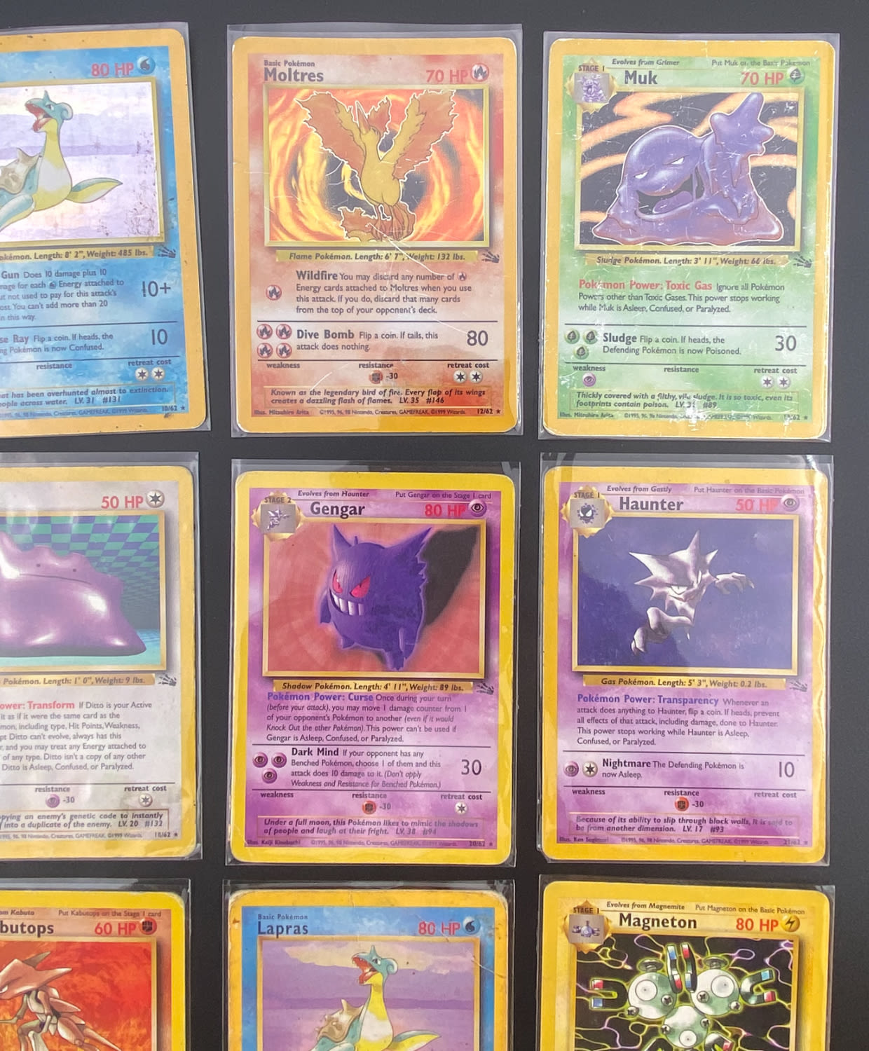 קלפי איסוף - לוט 15 קלפי פוקימון באנגלית - Rare + Holo Rare - Used - מהסט Fossil.
פוקימון (באנגלית: ... - 1 2