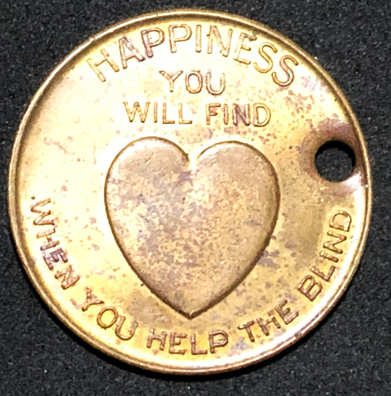 A medal for protection and safety for donation to the blind. - 1 1