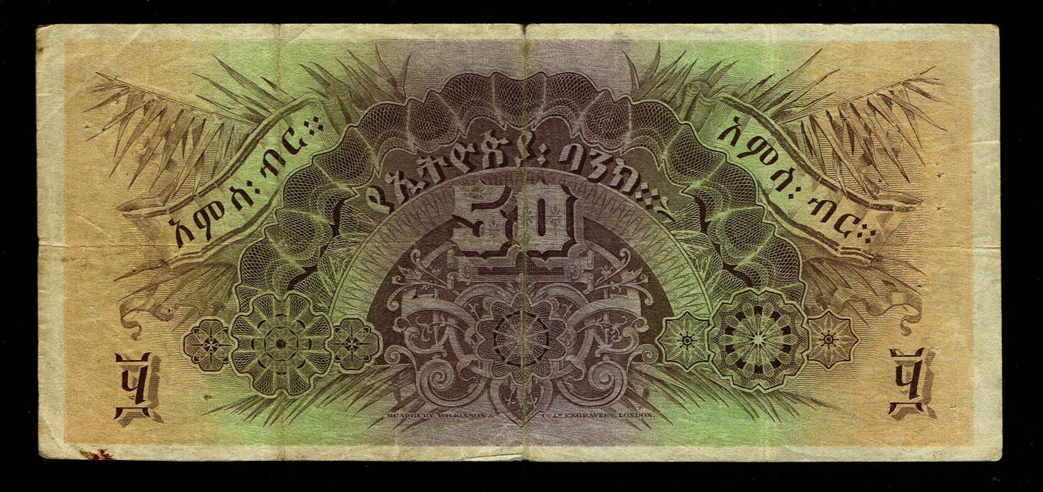 Ethiopia - 50 Thalers 1932 - F-VF
Obverse
Lion at centre, arms at upper right, bank building ... - 1 1