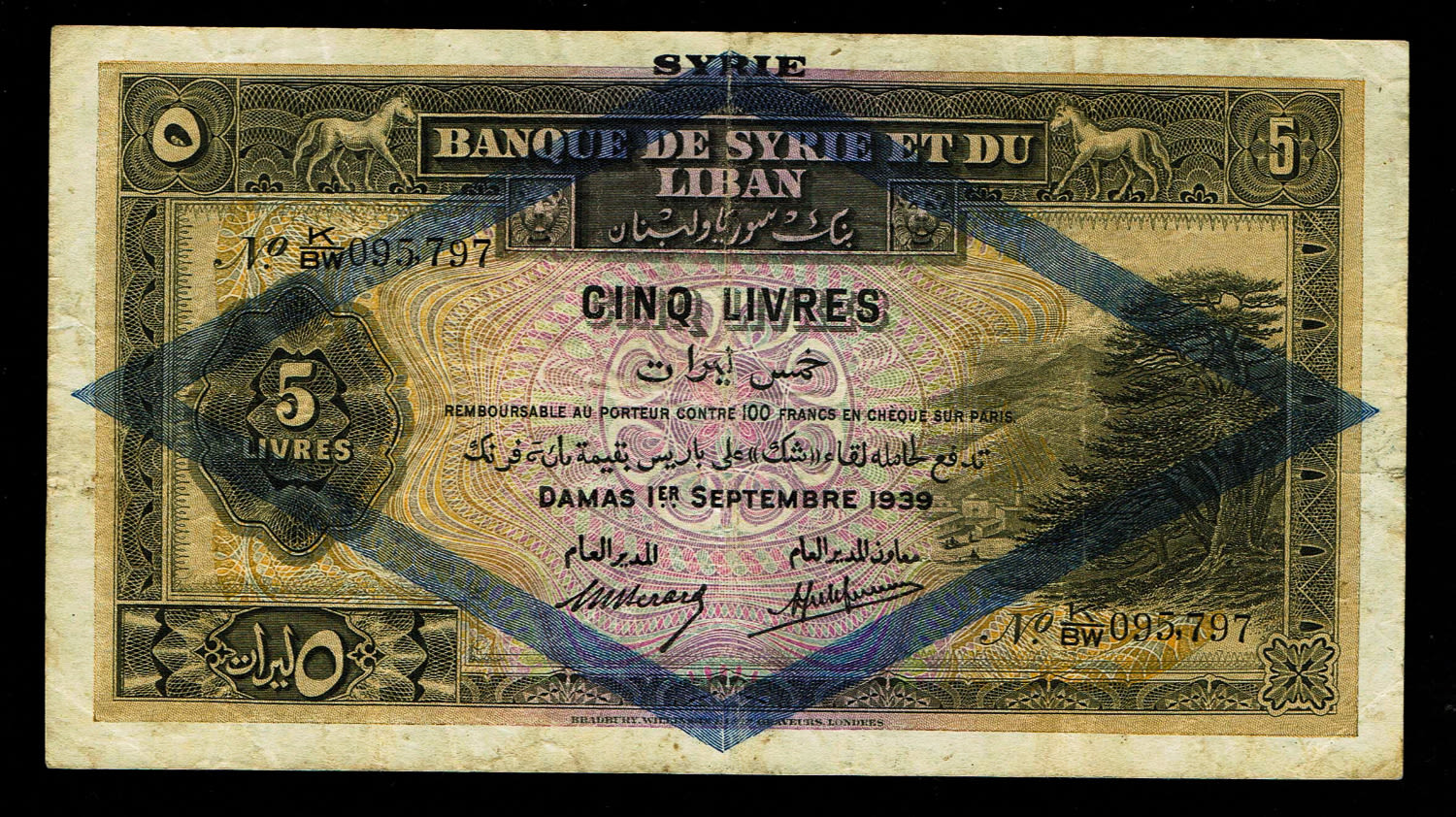 Syria - 5 Livres 1939 - VF
Obverse
Cedar tree at left
Lettering:
SYRIE ... - 1 0