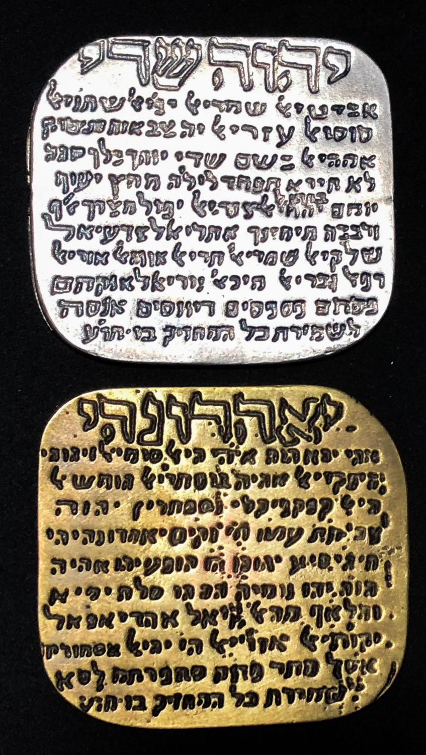 2 plates that probably designated for protection.
At the top there's the specific name of God in hebrew ... - 1 0