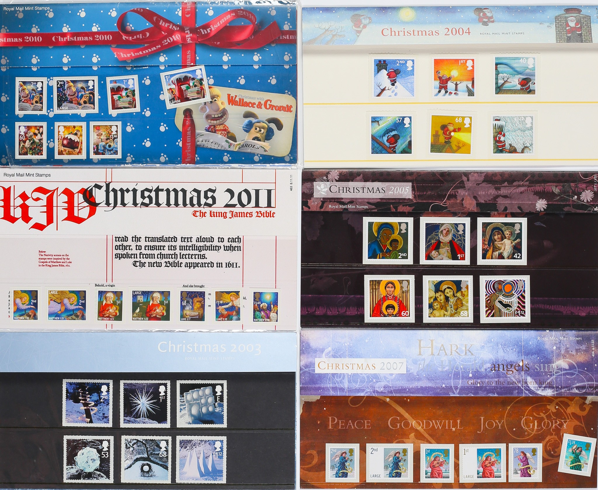 Collection of Christmas Stamp Presentation Sets. Includes Wallace and Gromit 2010, The King James Bible 2011, and ...
